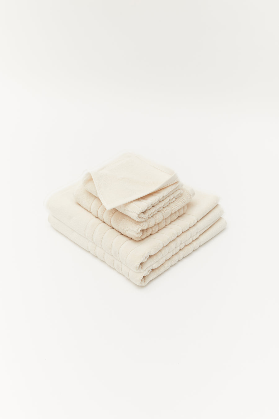 alt="Close-up of Laze Res bathe set soft, embossed organic cotton texture from the bath set collection"