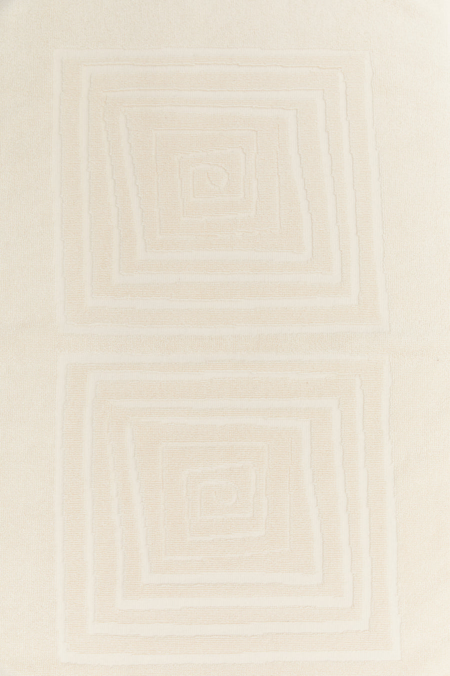 alt="Detailed view of Laze Res hand towel's signature embossed finish on organic cotton fabric"
