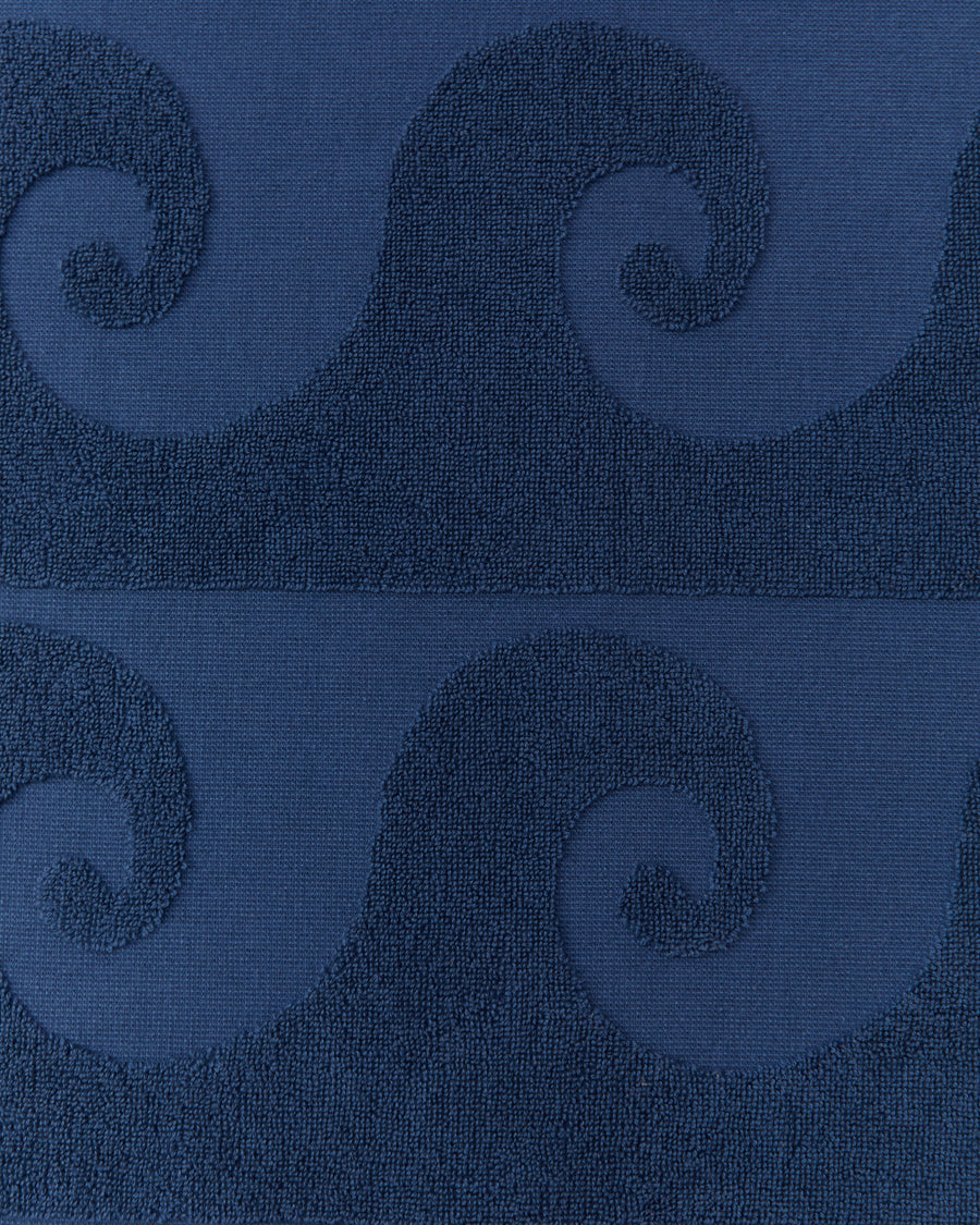 alt=“Detailed view of Laguna Towel’s unique embossed pattern on soft, deep blue Turkish cotton fabric”