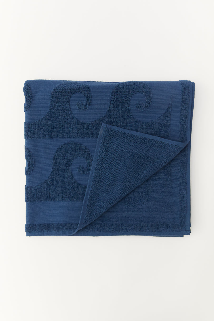 alt=“Laguna Towel neatly rolled, emphasizing compact form and rich blue color of Laze Res x Journal 1992 collaboration”