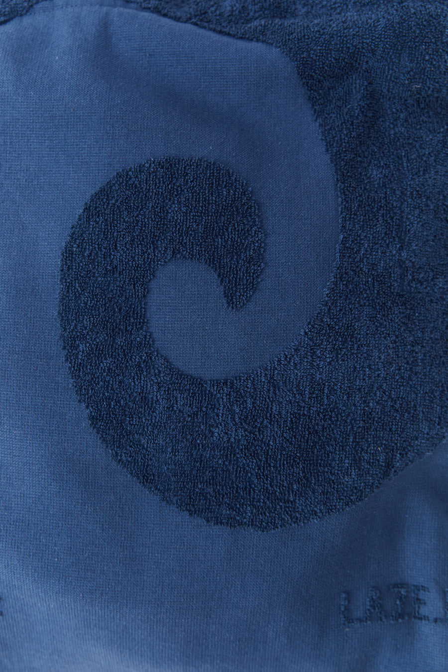 alt="Close-up of Noosa Bag's embossed jacquard weave on soft cotton canvas"

