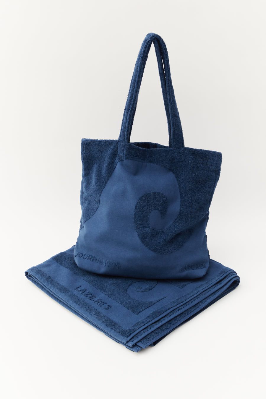alt="Close-up of Noosa Bag and Laguna Towel embossed jacquard weave on soft cotton canvas"