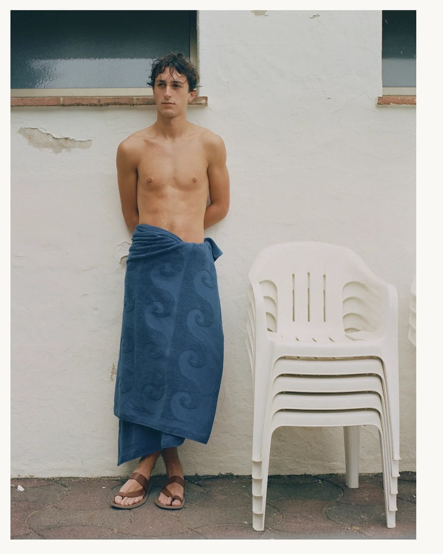 alt=“Laguna Towel in Deep Blue by Laze Res x Journal 1992, showcasing unique embossed print on 100% Turkish cotton”